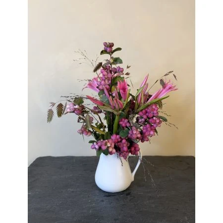 Seasonal Flower Jug with pink flowers and foliage by The Real Flower Company